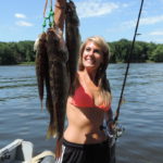 Excited angler hold up her beautiful catch of Walleyes.