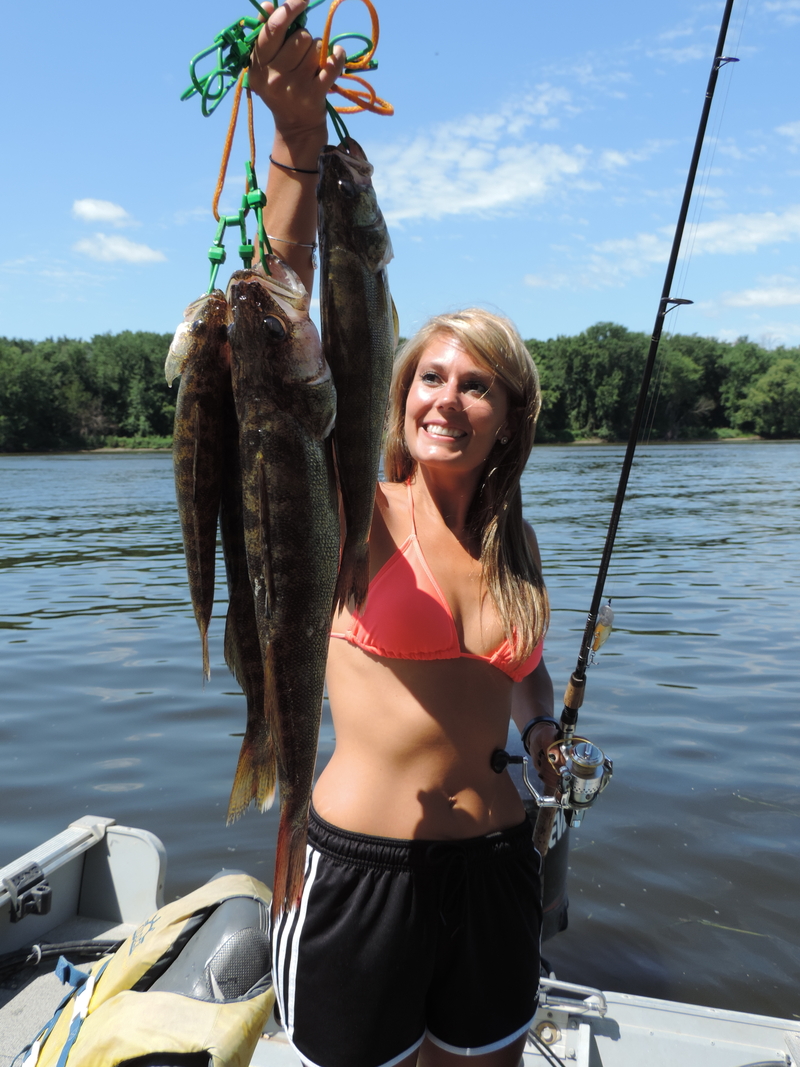 Excited angler hold up her beautiful catch of Walleyes.